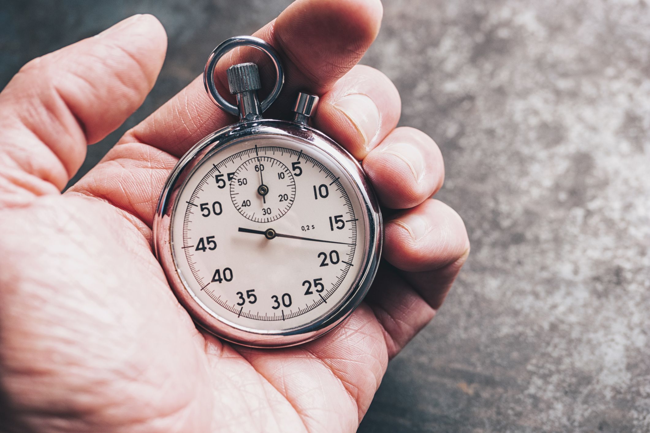 cropped hand of person holding stopwatch royalty free image 923207256 1547465897